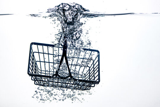 an empty supermarket trolley fell into the water
