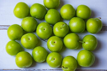 Fresh ripe organic green plum, close-up.