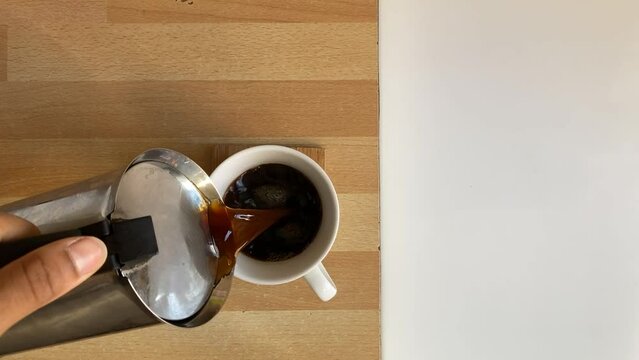 Overhead Shot Pouring Coffee Into Mug.