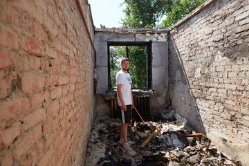 Obraz na płótnie Canvas Man, resident of the Chernihiv, whose house was destroyed by russian artillery