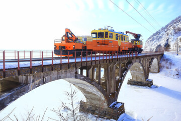 Circum-Baikal railway train on the bridge, travel across Russia Siberia