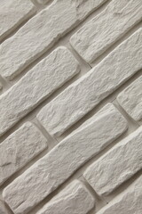 Diagonal white brick wall for a close-up background.