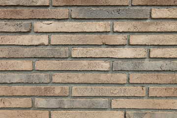 Textured red brick wall, stone texture. Decorative brick. A structural surface imitating an old brick. Loft-style decor. Structural surface.