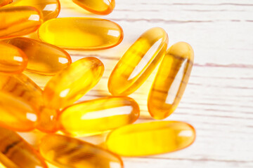 Fish oil or Cod liver oil gel in capsules with omega 3 vitamins, supplementary healthy food .