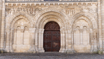 Fototapeta na wymiar Beautiful sculptures at entrance of Eglise Notre-Dame la Grande in Poitiers in province Vienne Nouvelle-Aquitaine region in France
