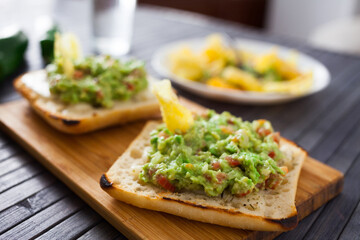 morning toast with melted cheese and guacamol