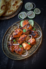 chicken tikka Boti seekh Kabab platter with salad in a dish top view of middle eastern barbeque dish