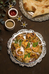 chicken malai tikka Boti seekh Kabab platter with salad in a dish top view of middle eastern barbeque dish