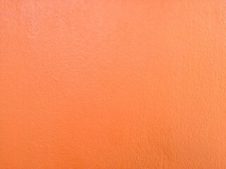 orange cement wall background with grunge textured.