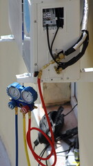 Air conditioner outdoor wall unit freon filling with pressure manometers appliances
