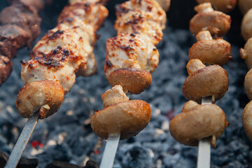 Appetizing mushrooms are fried on the grill....