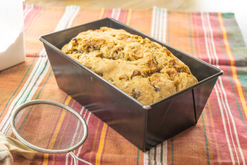 Fruitcake Loaf cake on a black plate. food concept
