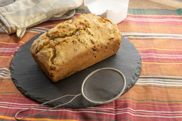 Fruitcake Loaf cake on a black plate. food concept
