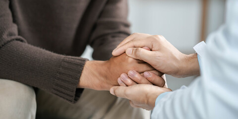 Male doctors shake hands with patients encouraging each other and praying for blessings. To offer...
