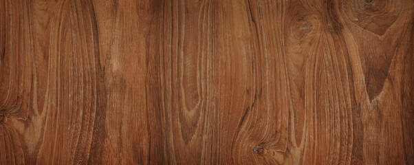 Naklejka premium Brown wood texture background coming from natural tree. Walnut wooden panel has a beautiful dark pattern, hardwood floor texture