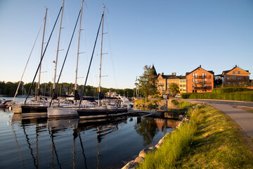 Sweden. Gustavsberg. City embankment with boats and yachts on a summer evening