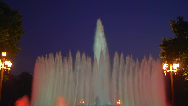 Magic singing magic fountains of Montjuic, people watch the performance