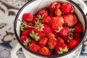 fresh and fragrant strawberries, spring harvest in a plate close-up