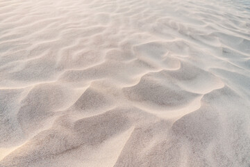 Fototapeta na wymiar Fine sand texture in the dunes at sunset
