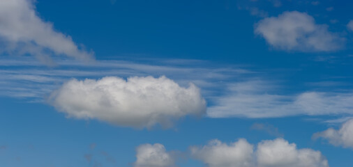 Naklejka na ściany i meble Cumulus and stratus clouds and blue sky.