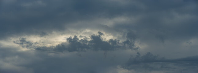 Gray storm clouds at sunrise.