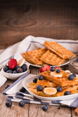 Waffles with blueberries, bananas and honey.