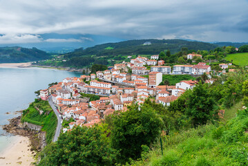 Fototapeta na wymiar View of Lastres and the Cantabrian Sea from the viewpoint of San Nicolas, Asturias.