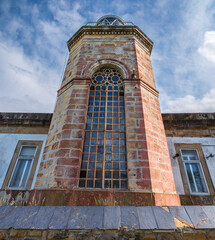 Fototapeta na wymiar Tazones lighthouse, in the council of Villaviciosa, in operation since 1864, Asturias.