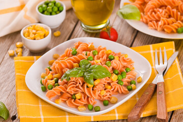 Fusilli pasta with peas and sweet corn.