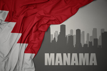 abstract silhouette of the city with text Manama near waving national flag of bahrain on a gray background.3D illustration