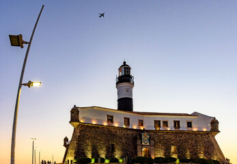 Famous Barra lighthouse in the city of Salvador in Bahia during sunset