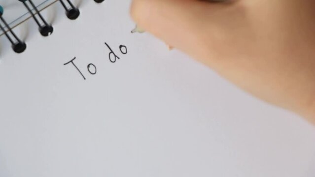 Write Text goals on notebook with pen on office desk. top view, copy space