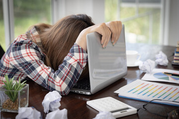 Young woman showing stress while working, failure to work.