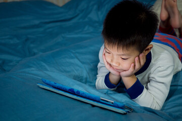 asian chinese boy playing smartphone, kid use phone and play game, addicted game and cartoon

