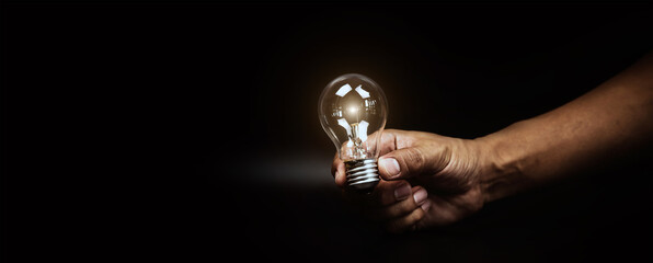 Close up hand choose light bulb or lamp for human resources or leadership and creativity thinking idea motivation or vision and knowledge learning and study or education concept.