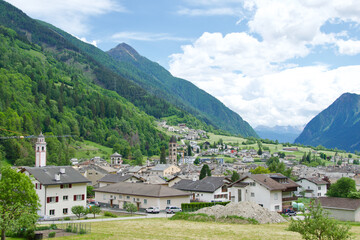 Fototapeta na wymiar The famous Bernina Express Train passing through Poschiavo in Switzerland
