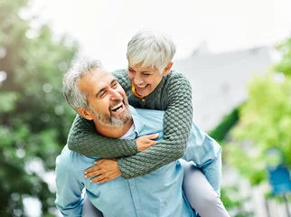 Foto op Plexiglas woman man outdoor senior couple happy lifestyle retirement together smiling love piggyback active mature © Lumos sp