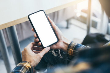 cell phone blank white screen mockup.hand holding texting using mobile on desk at office.background empty space for advertise.work people contact marketing business,technology