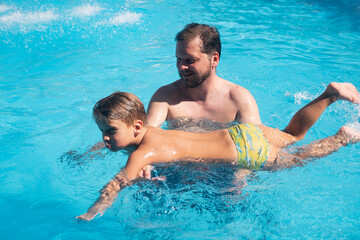 a man father with a child son boy playing in a summer pool