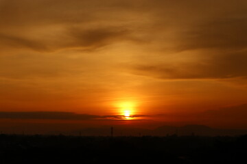 Beautiful evening sunset morning sunrise scenery from rooftop  with amazing clouds and red sky in the background 