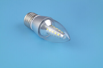 Led light bulb on blue background with copy space for text.