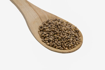 cannabis seeds on a wooden spoon isolated on white background, copy space top view horizontal. Banner, cover, mockup, for your design