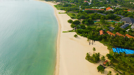 Aerial drone of Beautiful tropical beach and blue sea. Pasikuda Beach, Sri Lanka. - obrazy, fototapety, plakaty