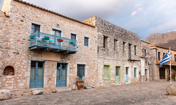 Greece. Areopoli village, Mani Laconia, Peloponnese. Stone building, paved street, historic square.