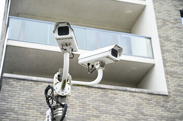 CCTV camera on the pole. Professional Security cameras scanning the street. Recording video with...