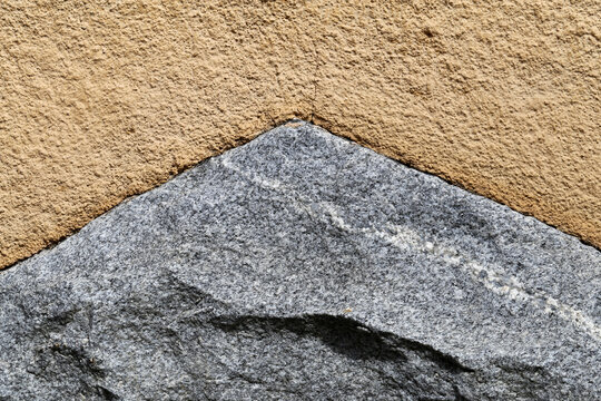 Yellow Wall With Some Grey Stone Details In A Closeup. Architecture Details In Helsinki, Finland, June 2019. Beautiful Background Texture.