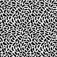 Abstract pattern of bold black shabby dots or spots on white background. Speckles of different size texture. Chaotic ink brush scribbles decorative texture. Monochrome hand drawn ornament.