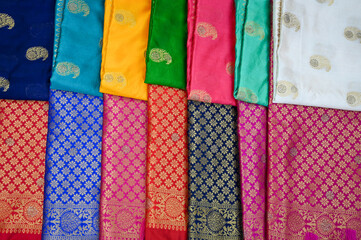 Display of Indian Sarees, Colorful Fancy Sarees in Saree Store, ready to be sell in market. 