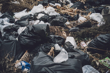 Waste plastic bottles and other types of waste at the ground
