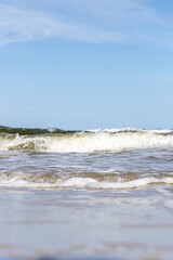 High and dangerous waves on the beach of Zempin on the island of Usedom on a beautiful day